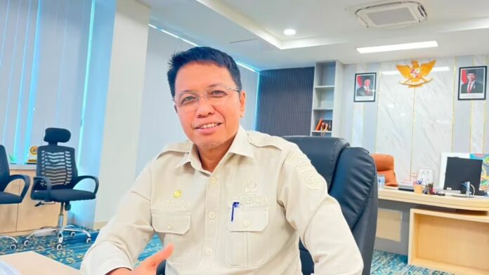 Kepala Bapenda Mimika, Dwi Cholifa Kepala Bapenda Mimika, Dwi Cholifa, pajak kendaraan, plat luar, Bapenda Mimika, Samsat Mimika, pendataan kendaraan, Timika Papua